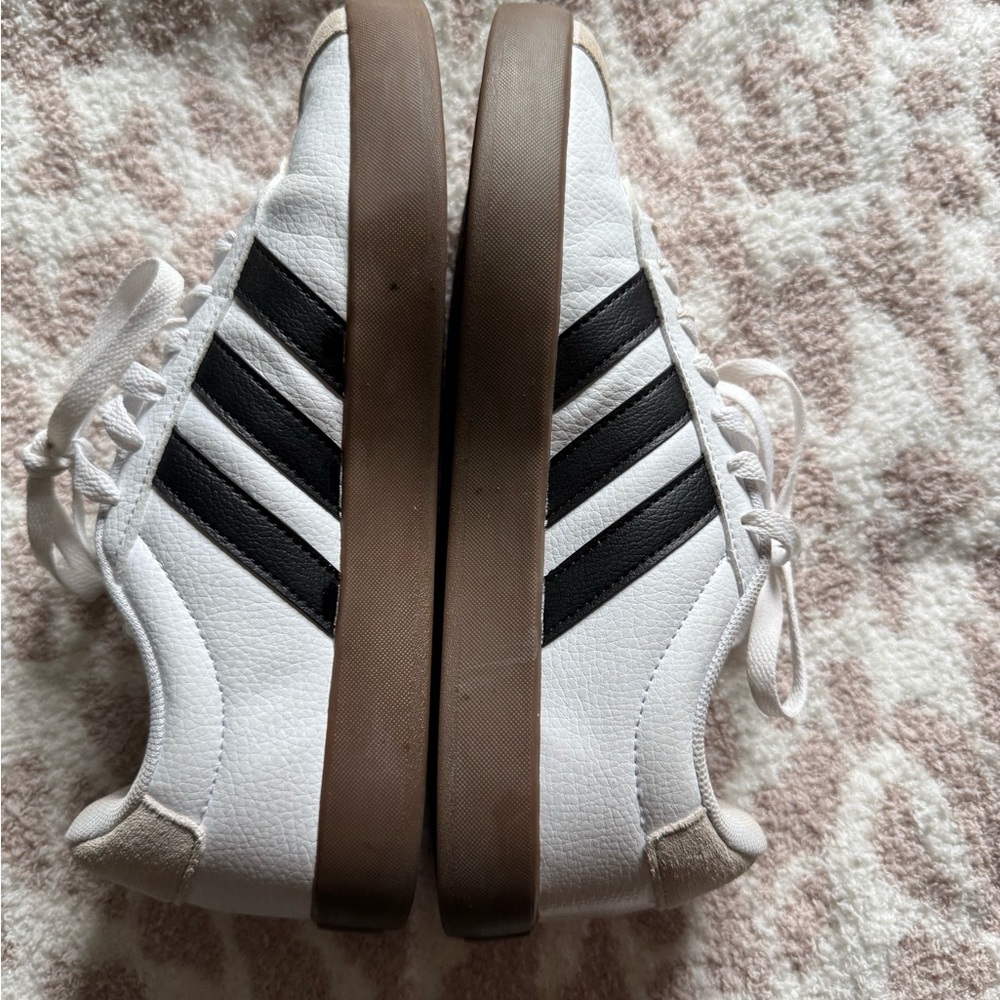 White Sneakers with Black Stripes